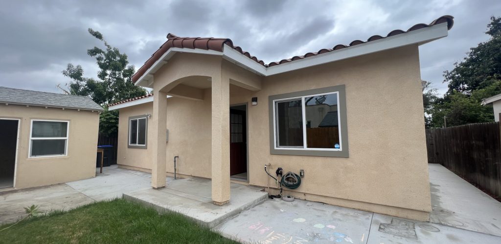 After stucco exterior and arch entryway.