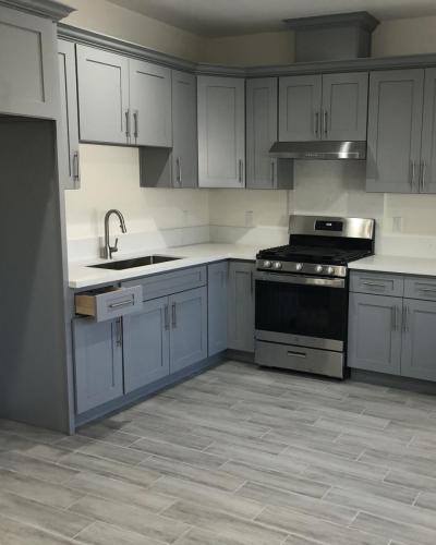 Gray shaker cabinets and quarts kitchen countertops